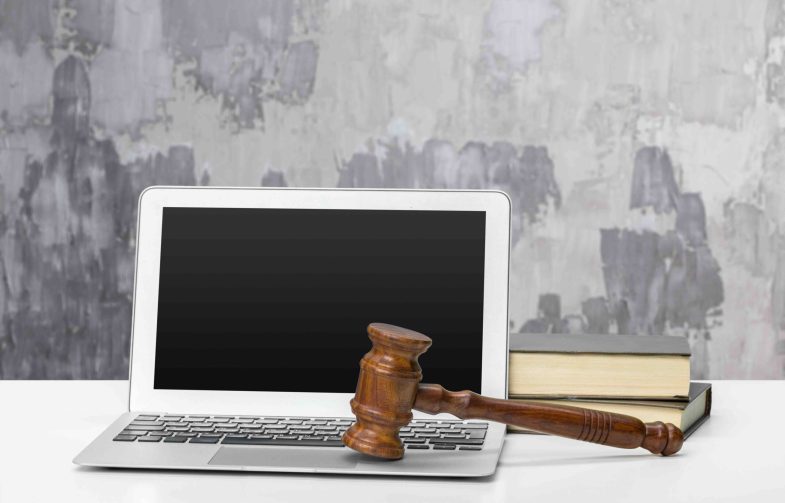 Laptop And Mallet On Table